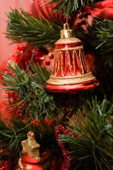 Christmas toy bell on tree branch