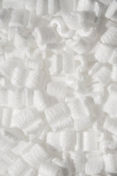 several white styrofoam packing peanuts close up shot