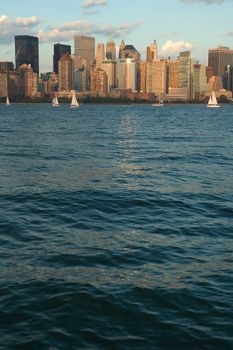 lower manhattan vertical photo, dusk photo, buildings and yachts