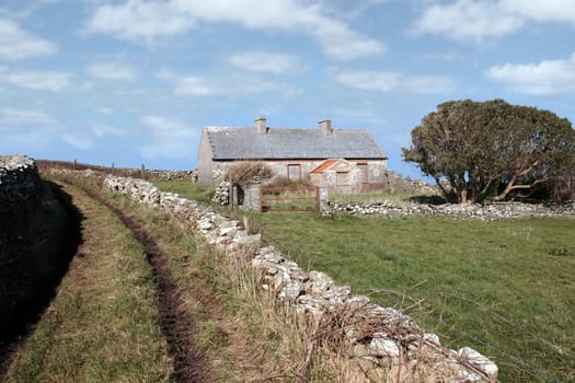 a derelict house in the irish countryside in county kerry ireland