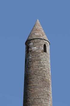 a round tower near ballyduff county kerry ireland with blue sky background