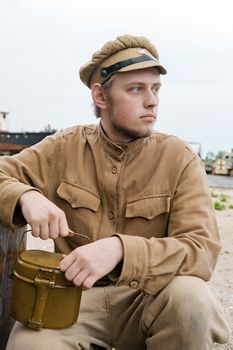 Soldier with a boiler in uniform of World War I. Costume accord the times of World War I. Photo made at cinema city Cinevilla in Latvia. Cockade on the hat do not contain trade mark.