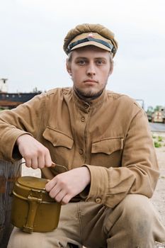 Soldier with a boiler in uniform of World War I. Costume accord the times of World War I. Photo made at cinema city Cinevilla in Latvia. Cockade on the hat do not contain trade mark.