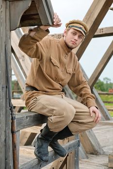 Soldier with a gun sitting next to the sentry.
Costume accord the times of World War I. Photo made at cinema city Cinevilla in Latvia.