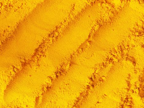 close up of a heap of grounded turmeric powder