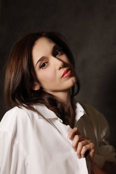 Portrait of the beautiful brunette in studio