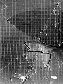 Detail of a broken glass window pane