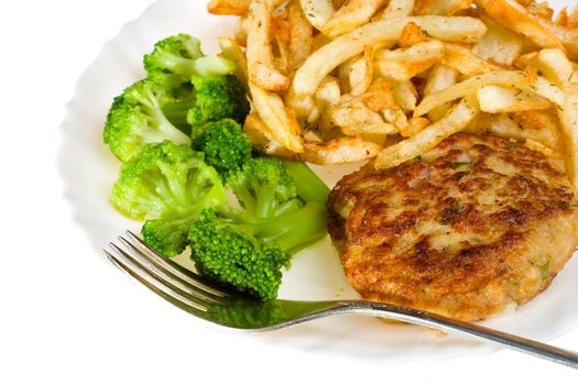 close-up cutlet with broccoli and potatoes on plate, isolated