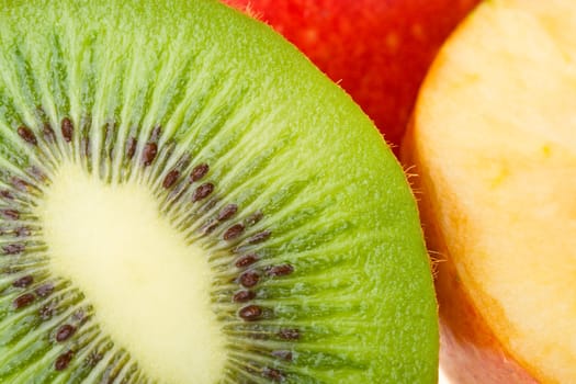 close-up green kiwi and red apples