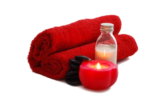 Romantic Valentine Day SPA set with candle including heart shaped towel, moisturizer and pebbles on white background