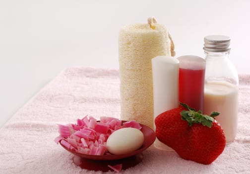 Romantic pink SPA set with huge strawberry including soap, sponge, shampoo and moisturizer