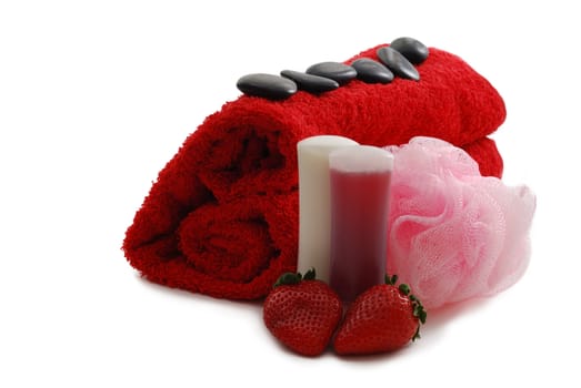 Romantic Valentine Day SPA set including heart shaped towel, soap, sponge, pebbles and strawberries on white background