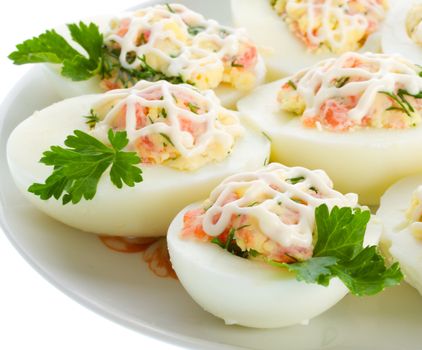 close-up stuffed eggs with trout, isolated on white