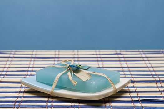 Spa background with hygiene and decorative items in blue.