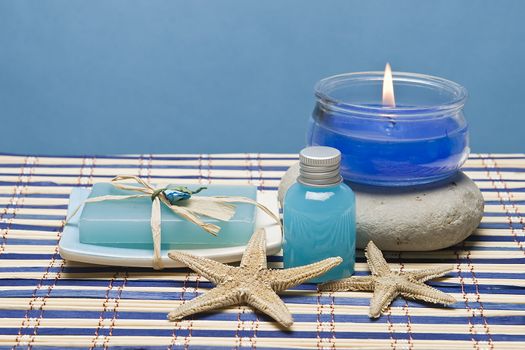 Spa background with hygiene and decorative items in blue.