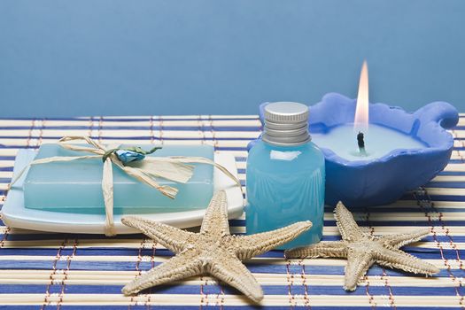 Spa background with hygiene and decorative items in blue.