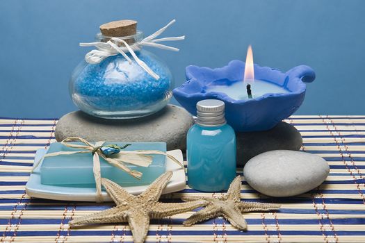 Spa background with hygiene and decorative items in blue.