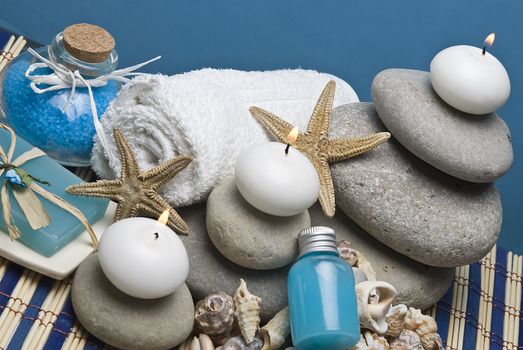 Spa background with hygiene and decorative items in blue.