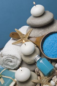 Spa background with hygiene and decorative items in blue.