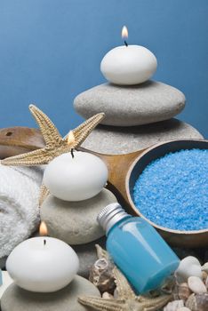 Spa background with hygiene and decorative items in blue.