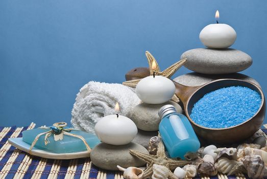 Spa background with hygiene and decorative items in blue.