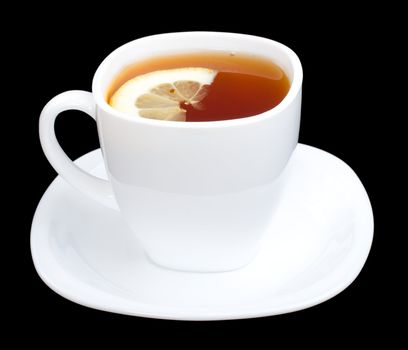 cup of tea with lemon and saucer, isolated on black