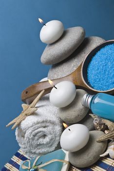 Spa background with hygiene and decorative items in blue.