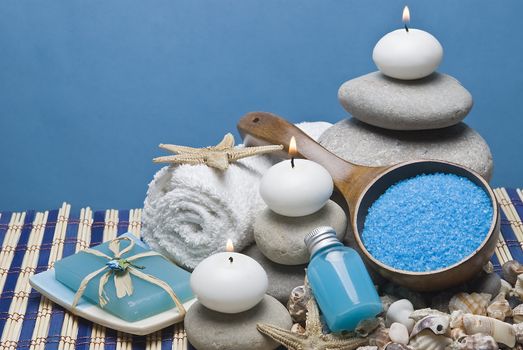 Spa background with hygiene and decorative items in blue.