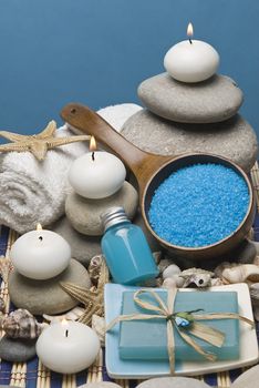 Spa background with hygiene and decorative items in blue.