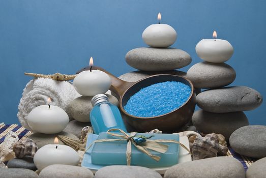 Spa background with hygiene and decorative items in blue.