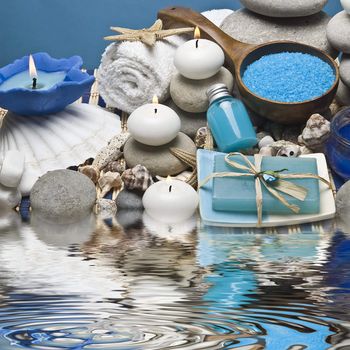 Spa background with hygiene and decorative items in blue.