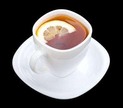 cup of tea with lemon and saucer, isolated on black