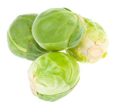 four brussels sprout in pyramid, isolated on white