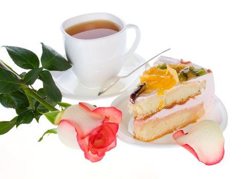 rose cake with fruits and cup of tea, isolated on white