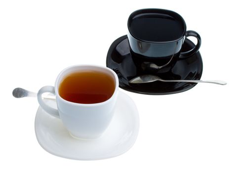 white and black cups with tea, isolated