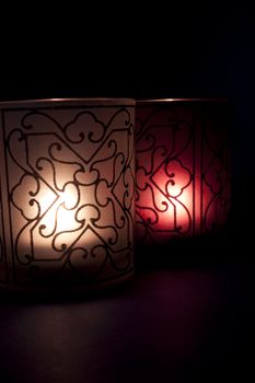 Stylized candles with light of hope in the darkness