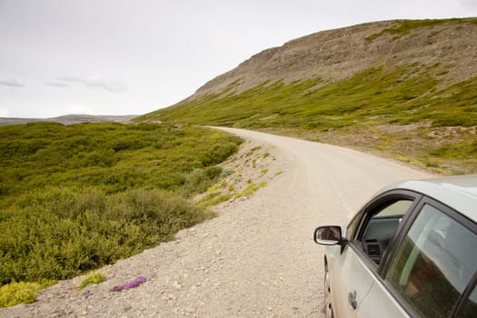 Small gravel route in Iceland. Westfjords. Summer cloudy day.