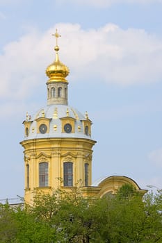 View of  dome of Peter and Paul Kathedral among  trees, Saint Petersburg, Russia.