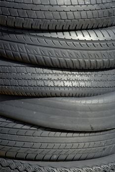 Photo of a stack of old car tires.