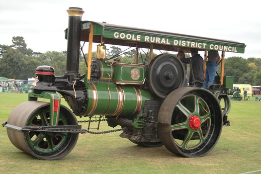 large green traction steam roller at a steam rally