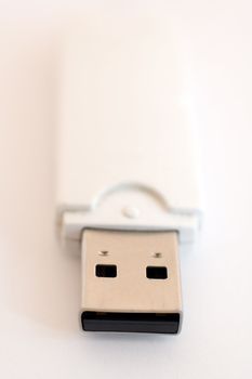 USB key detail photo, distance blur, white to pink background