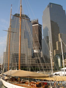 white yacht in front of world financial center
