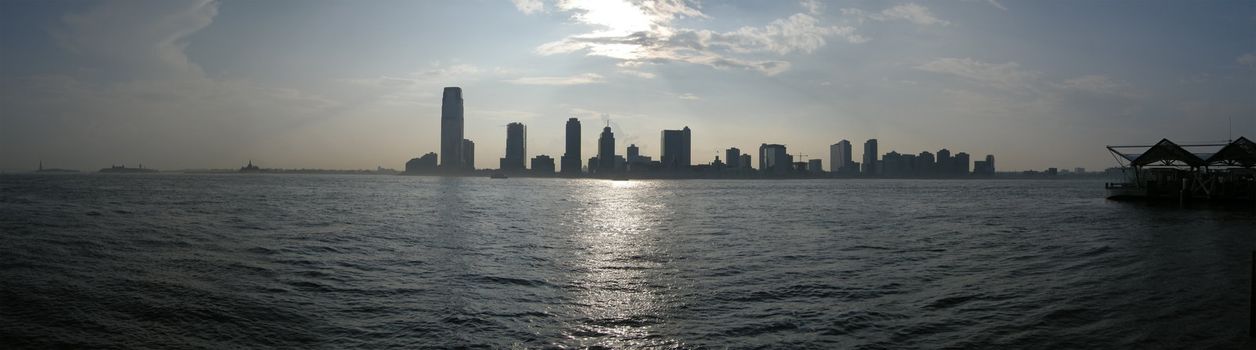 almost black and white panorama photo of jersey city, photo taken from manhattan