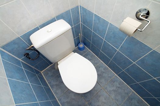 white clean toilet, white and blue tiles