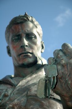 statue soldier holding his army marks detail photo, distance blur