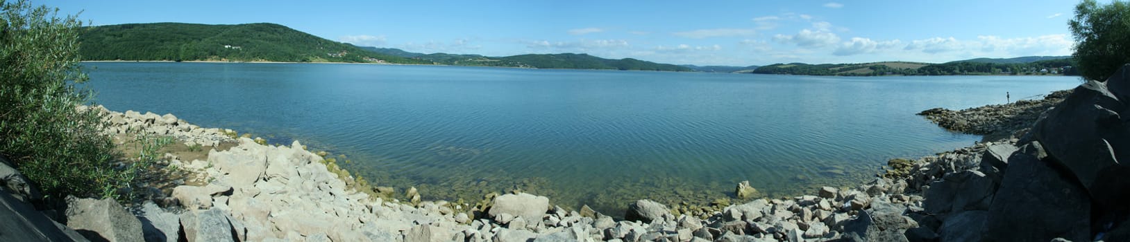 blue lake panorama, fisherman silhouette on right side, photo taken at Domasa, Slovakia