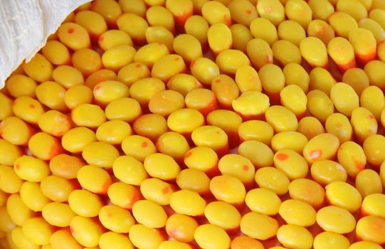 Closeup of candy corn and husks on a cake made to look like Indian corn