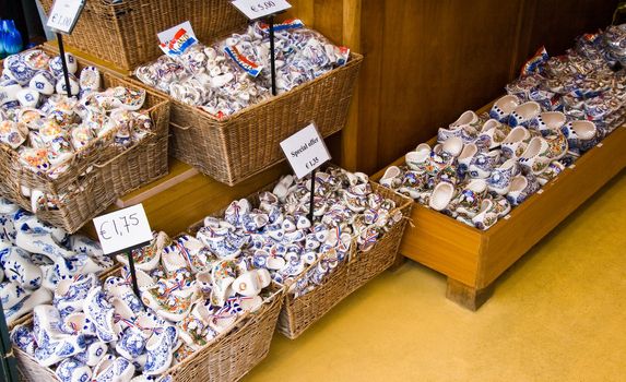 Display of Dutch blue delftware clogs in baskets offered for sale as a souvenir