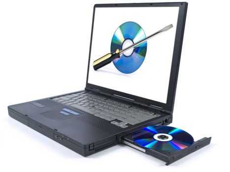 Isolated black laptop with a DVD in tray and a technical support icon on the screen.