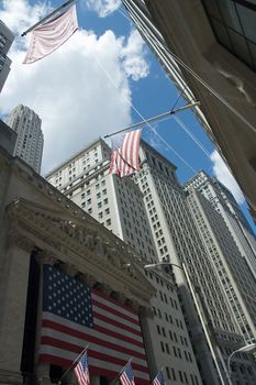 New York Stock Exchange, american flags, cloudy sky